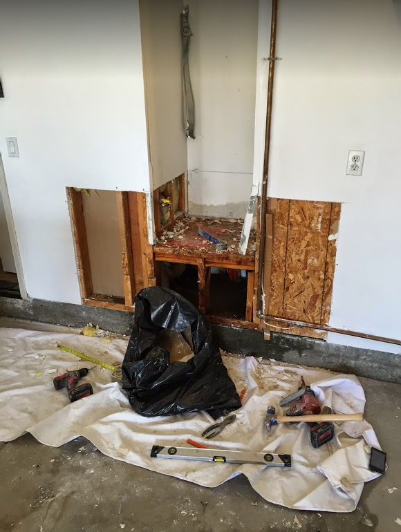 tripping-away-drywall-water-heater-area-mission-water-damage-restoration-san-diego-ca